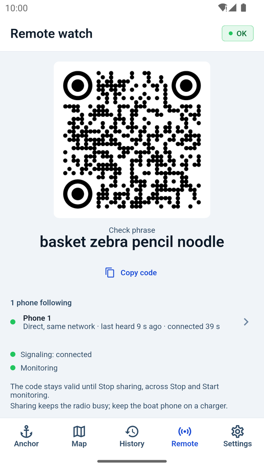 Remote watch screen with a QR code and check phrase, showing one phone following